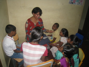 A volunteer teaching the children