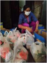 Mothers of the children helping to pack the kits