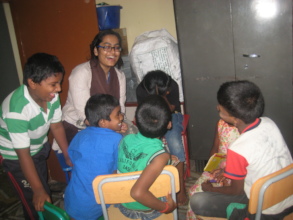 Volunteer teaching the children