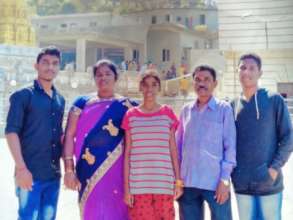 With his parents and siblings