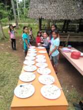 Students prepare lunch table