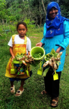 Gardener wearing rice sack apron with Principal
