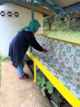 Teacher admires new school wash station