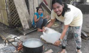 Moms cook lunch with clean water at Bunot Elem