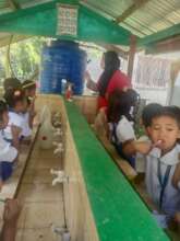 Brushing teeth at water station