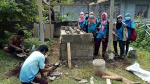 Teachers and volunteers build station together