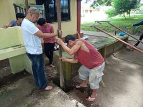 Local communities provide labor for wash station