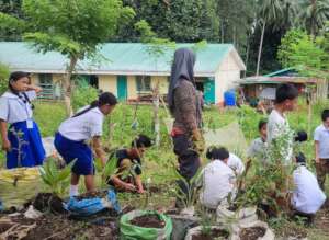 Children help maintain the school garden