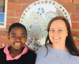 A thrilled Iva and Principal Sharon (2019).