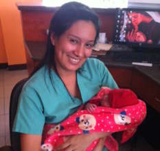 Nurse Celina with Maribel's healthy newborn