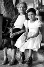 She prays her granddaughter will get an education.