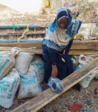 Mrs. Ali inspecting sand and ballast bought