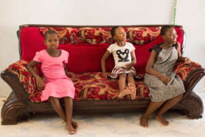 Loveness with two of her NHGO sisters.