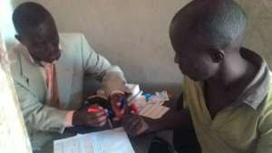 Derick counseling a patient