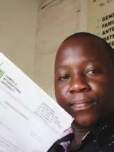Derick holding his admission letter!