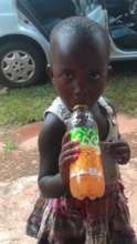 A treat of juice to one of the little patients