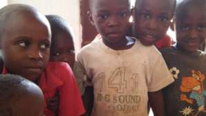 neighborhood children waiting to be dewormed