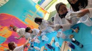 Girls at g4g Day Mexico dive into slime creation!