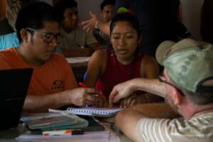 Students learning about development projects