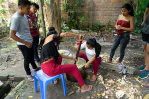 Students preparing the 'masato' traditional drink