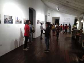 Enjoying the photo-exhibition with the students