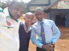 Teacher with some boys sponsored to high Sch.