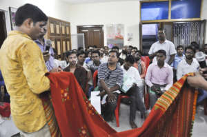 Jentibhai discusses with Varanasi weavers