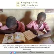 Dan and Godiya Reading in the Library
