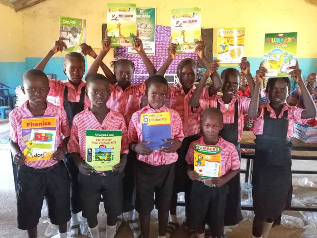 SOME OF THE PUPILS WITH SOME LEARNING MATERIALS