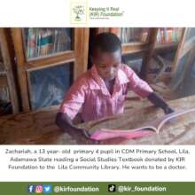 Zachariah a 13 year-old reading a textbook