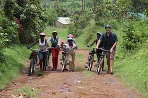 Volunteer and Girls with Bikes