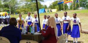 Guides Presenting a Poem to Judges