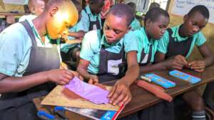 Students sew pads in our RUMPs training