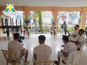 Teacher Adarley teaching English in a youth prison