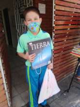 Students stop by the school to borrow books