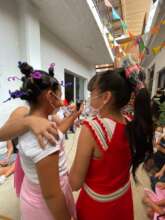 Performing for their classmates