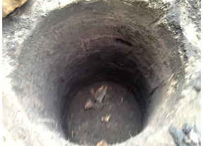 Escavated drainage pit: to be filled with gravel