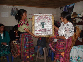 Housewives present EcoLogic with a gift of thanks.