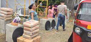 Dona Olga oversees distribution of materials