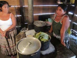 Josefina (right) and her fuel-efficient stove