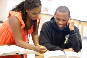 Mentors review SAT instruction with students.