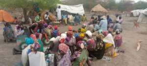 Discussing the program at community meeting.