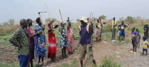 New farmers receiving tools.