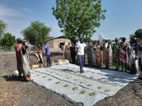 Farmers receive seeds.