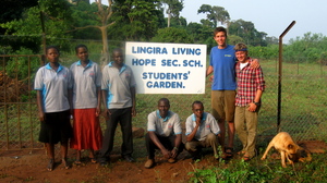 Sam, Paul and teachers in front of the new fence