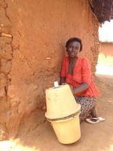 A woman who received a clay pot filtration system