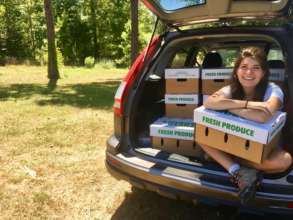 Outreach Coordinator, Emma, delivers CSA