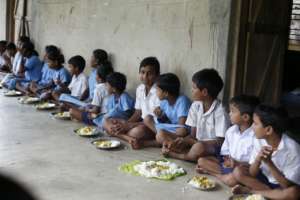 Children in school eating meal