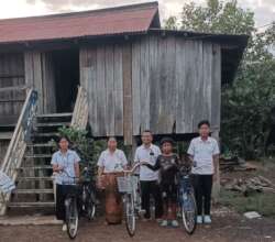 Happy parents with bicycle support for their kids