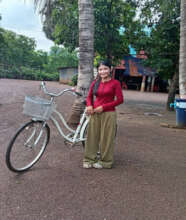 Risa with her bicycle for school